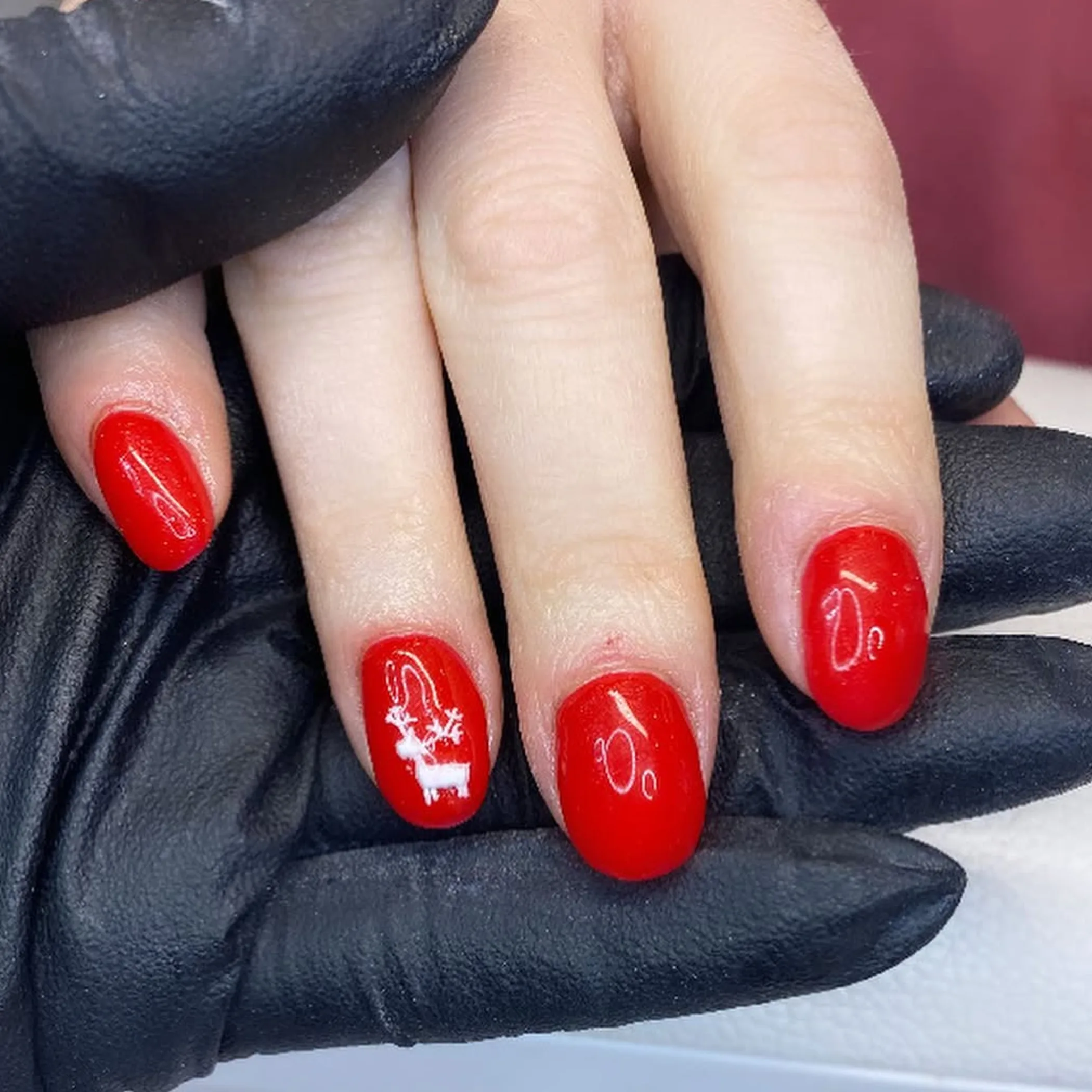 gloved hands applying single use waxing applicator